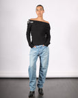 Off Shoulder Sweater with Spoon Brooch in Black by A.W.A.K.E. Mode