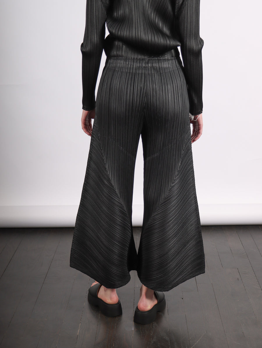 Thicker Bottoms 2 Flared Pants in Black by Pleats Please Issey Miyake-Idlewild